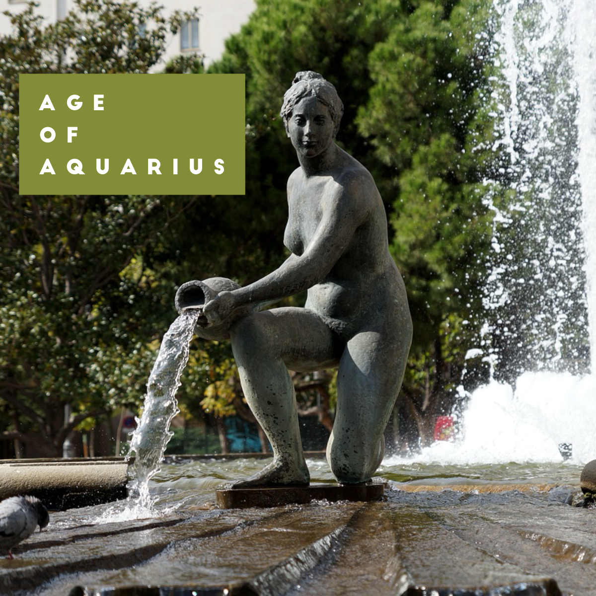 Aquarius statue with water, Age of Aquarius written in green box
