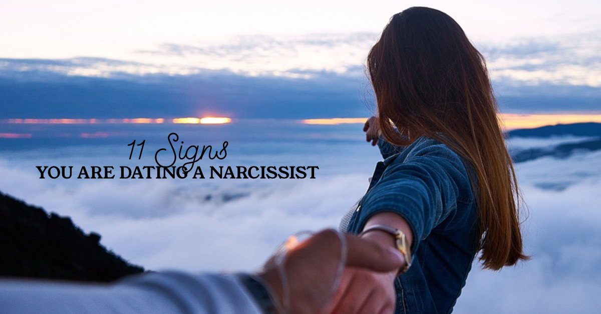 Woman turning away and looking into sunset with text "11 Signs you are dating a narcissist"