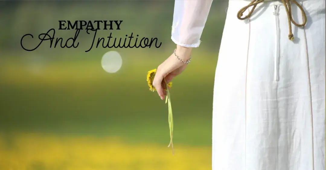 woman's hand holding a flower and facing away