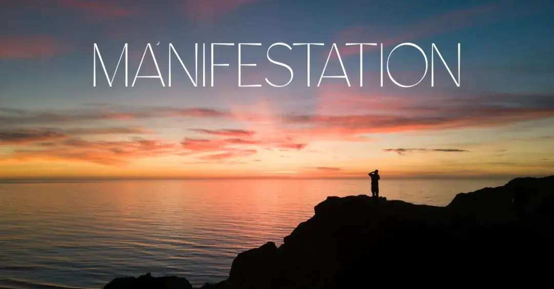 person looking at sunset horizon with text "manifestation"