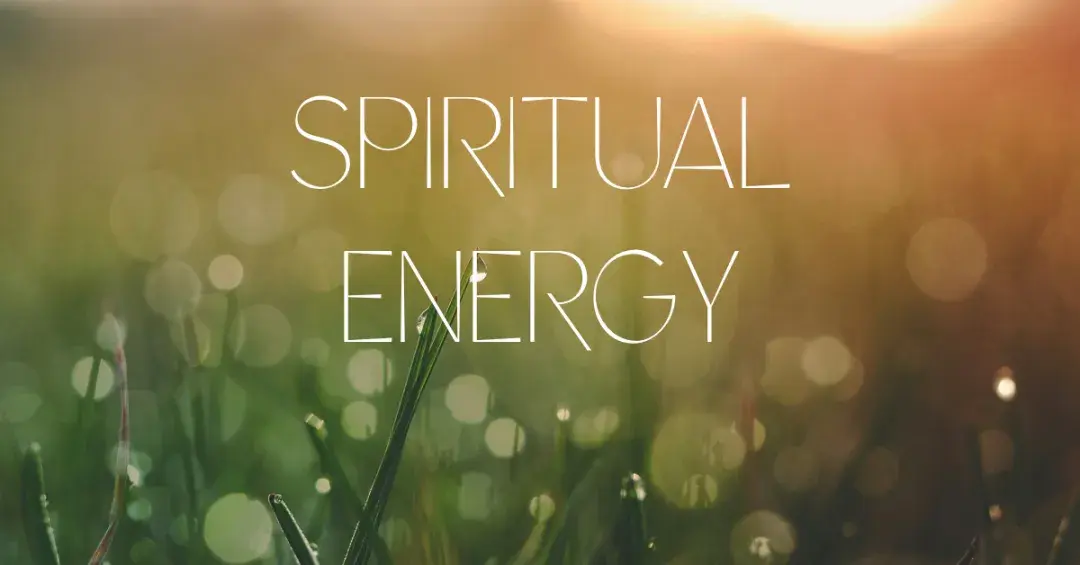 grass with dew on it in the morning sunlight with text "spiritual energy"