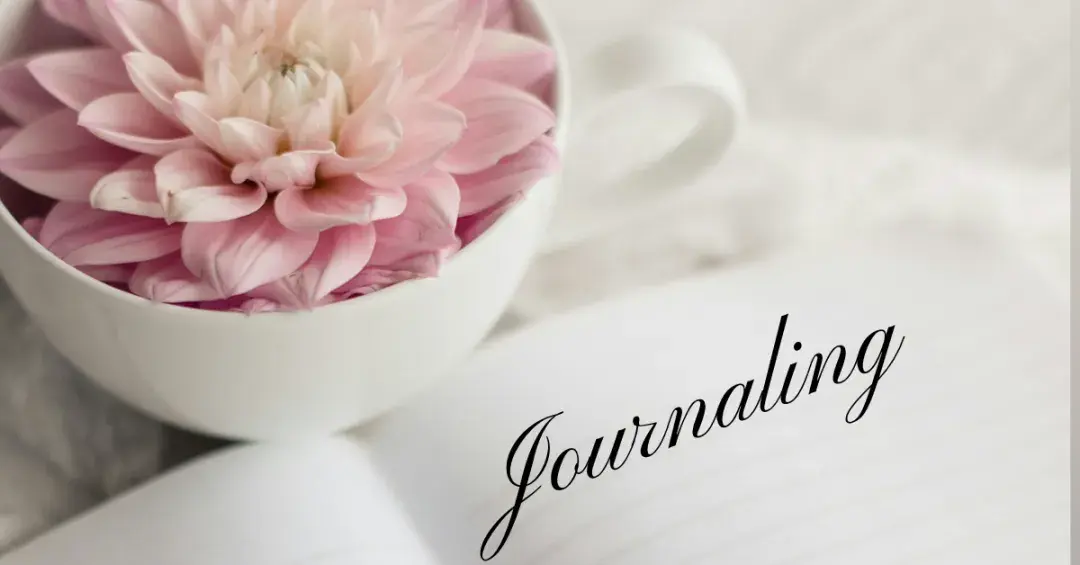 pink flower in a cup with a journal text "journaling"