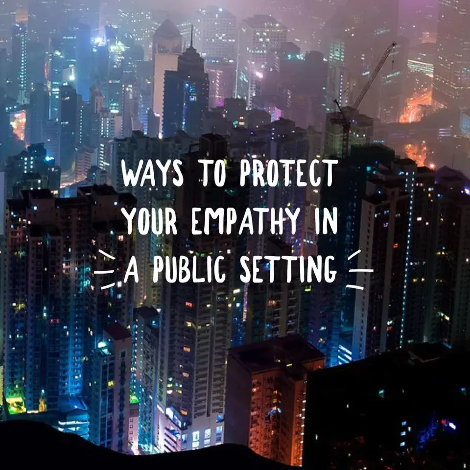 city scene at night from an elevated view with text "ways to protect your empathy in a public setting"