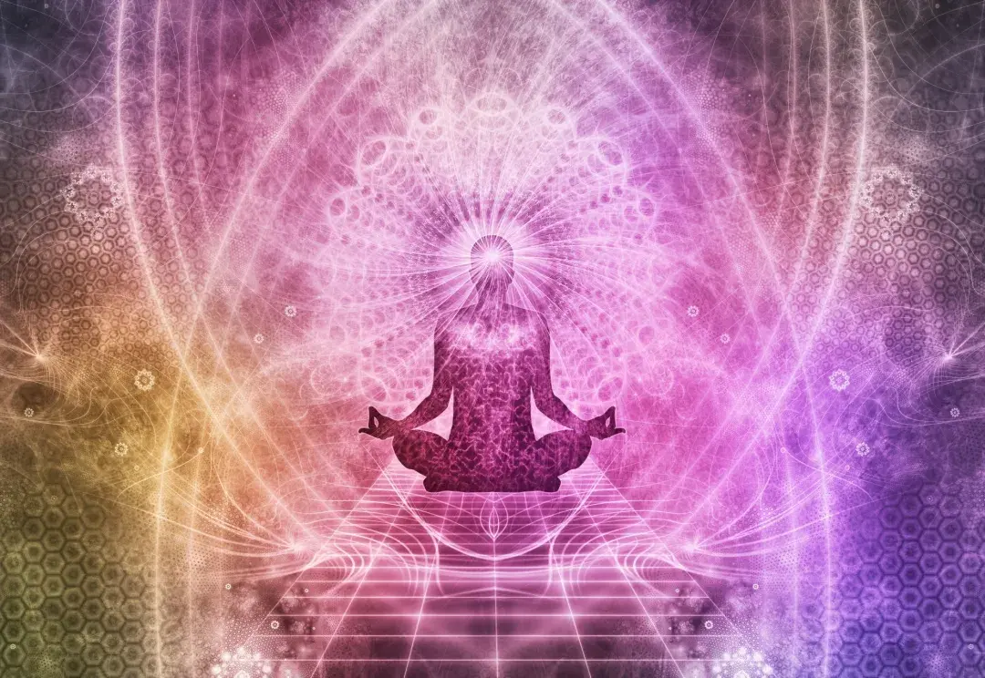 meditating human form in lotus position with energy all around