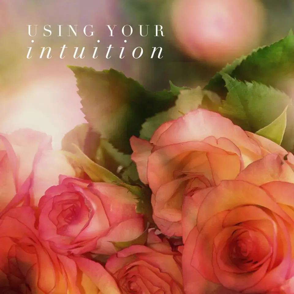 pink and yellow roses blurred with text "using your intuition"