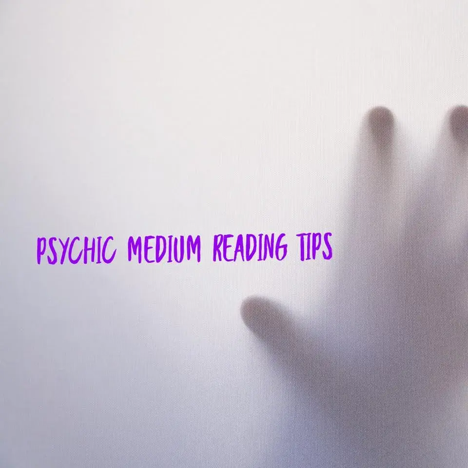 grey screen with hand on other side touching screen with text "psychic medium tips"