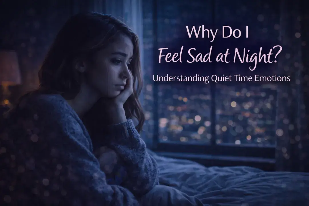 Woman sitting by a window at night feeling sad and reflective