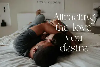 Two people embracing on bed text "attracting the love you desire"
