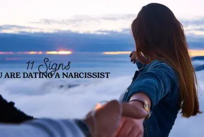 Woman turning away and looking into sunset with text "11 Signs you are dating a narcissist"