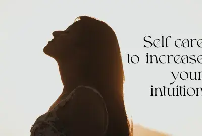 Woman looking up with text "Self Care to Increase your intuition"