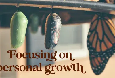 Butterfly chrysalis evolving with text "focusing on personal growth"