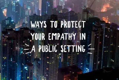 city scene at night from an elevated view with text "ways to protect your empathy in a public setting"