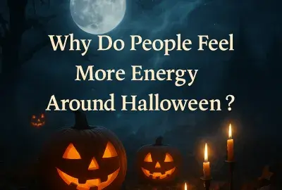 Halloween night scene with a glowing full moon, foggy blue sky, silhouetted trees, two carved jack-o’-lantern pumpkins, and four flickering candles on the ground, with the text “Why Do People Feel More Energy Around Halloween?” in cream-colored serif font across the center.