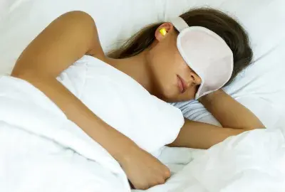 woman sleeping with sleep mask