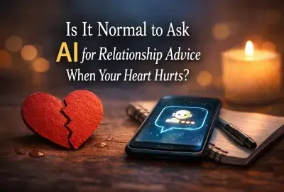 Broken heart beside a phone with AI chat and candle representing asking AI for relationship advice during heartbreak