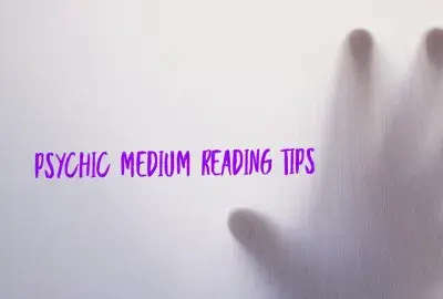 grey screen with hand on other side touching screen with text "psychic medium tips"