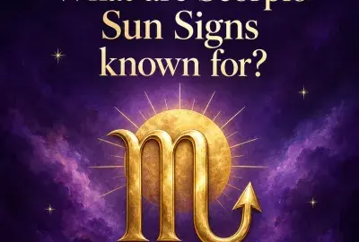 Gold Scorpio symbol in front of a glowing sun on a violet sky