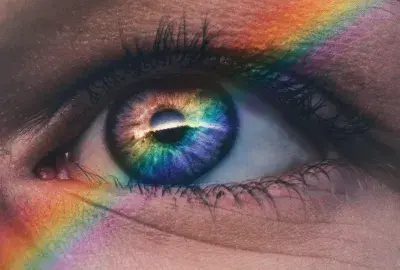 eye up close with a rainbow shadow
