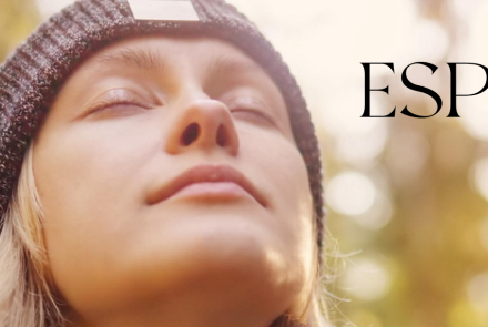 woman with eyes closed facing up with text "ESP"